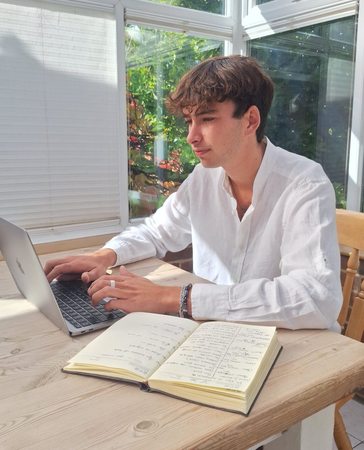 Thomas Rowe, Kent-based web designer at Rowe Creative, working on a website project.